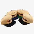 Creme colored hat with colored bill